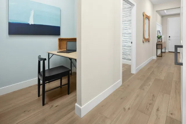 a view of a livingroom with furniture and wooden floor