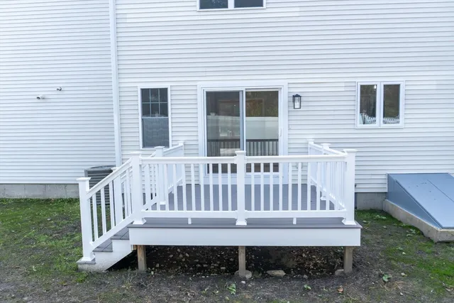 a view of a house with wooden deck