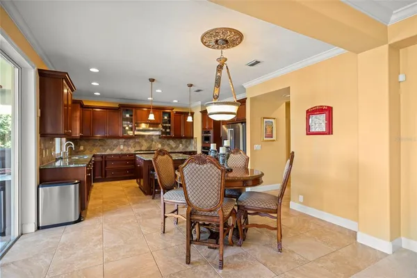 a kitchen with granite countertop wooden cabinets and a sink