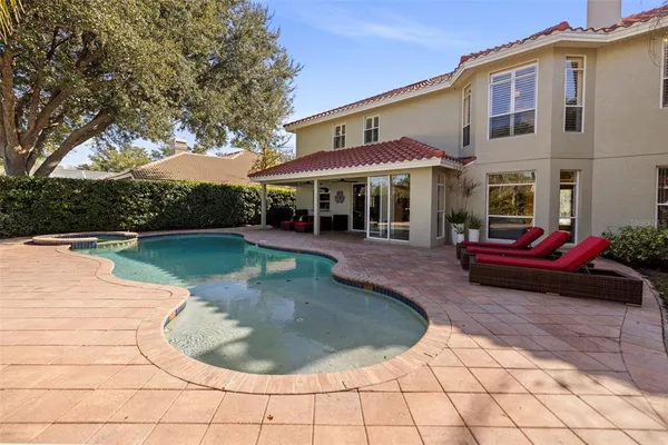 a view of a swimming pool with a yard