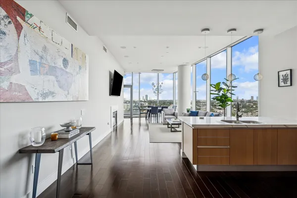 a view of a dining room with furniture window and wooden floor