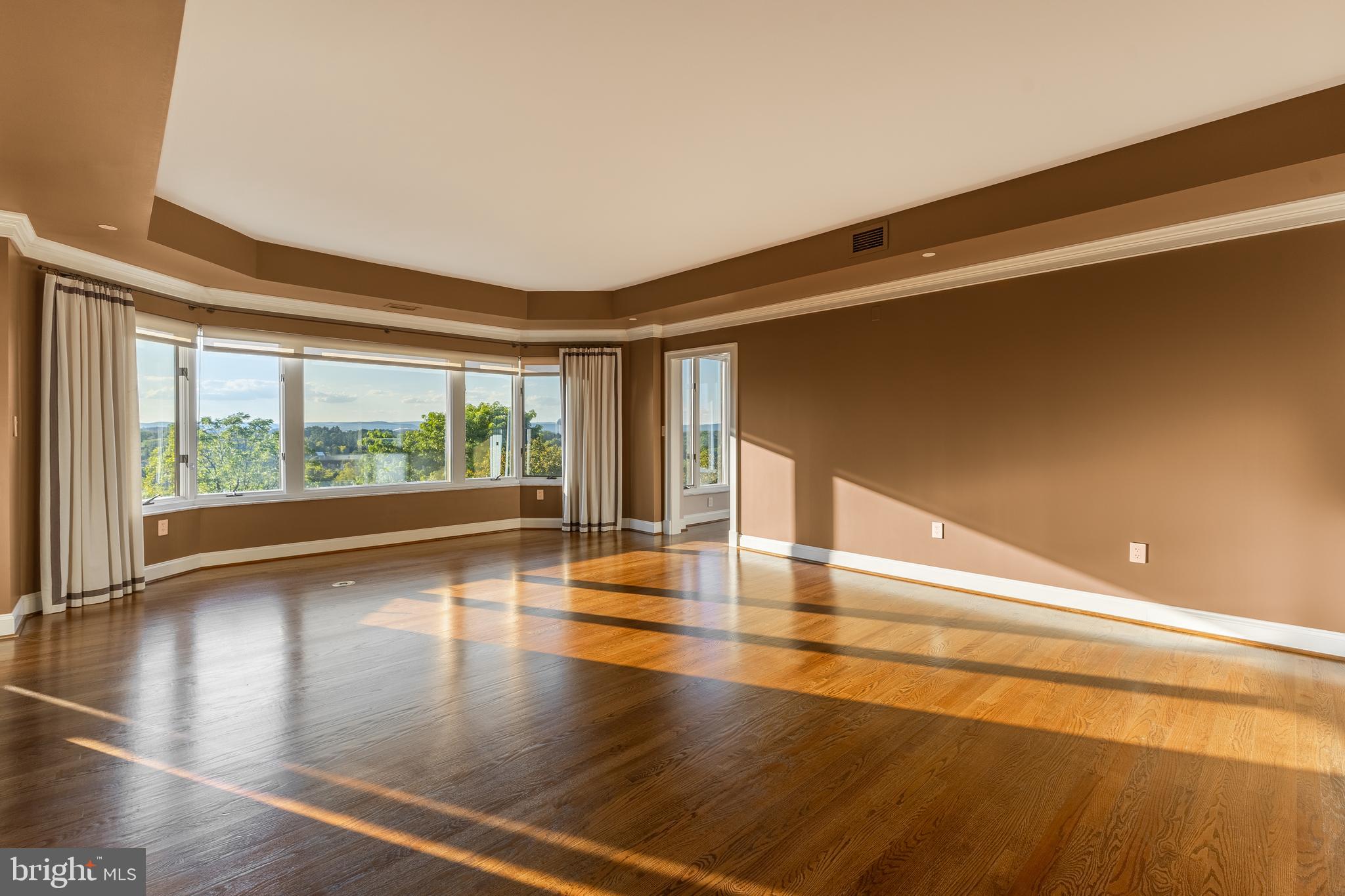 425 Windmere Drive, Unit 3B State College, PA 16801 - Photo 28 of 42 a view of room with window and wooden floor