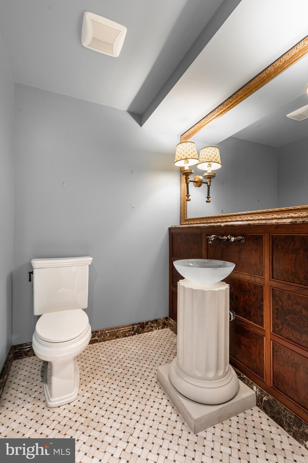 425 Windmere Drive, Unit 3B State College, PA 16801 - Photo 31 of 42 a bathroom with a toilet a sink and mirror
