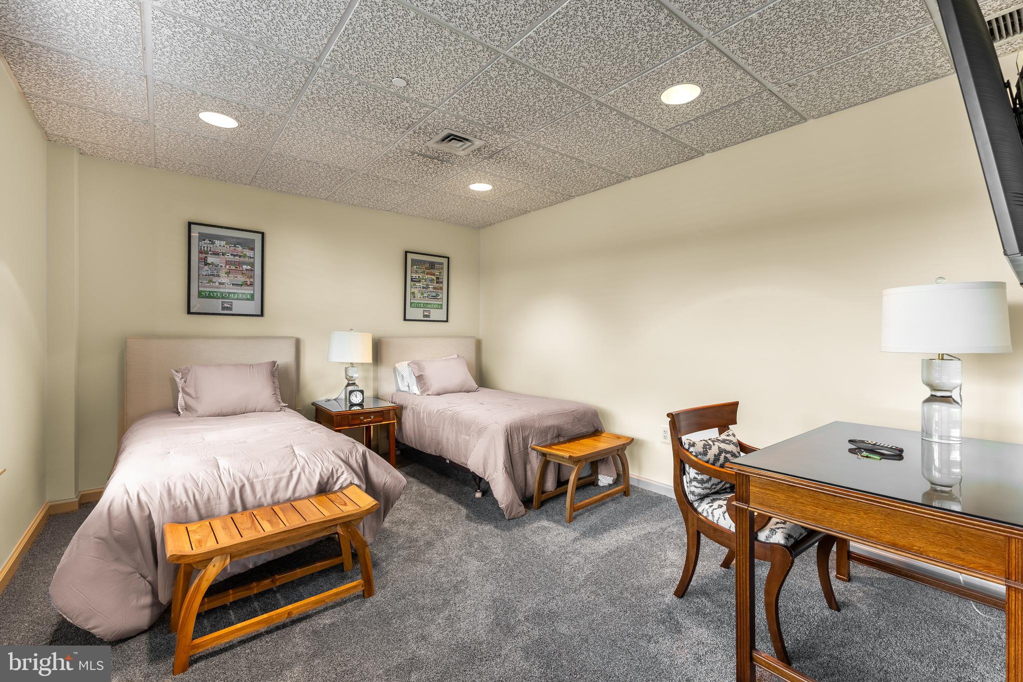 425 Windmere Drive, Unit 3B State College, PA 16801 - Photo 42 of 42 a bedroom with two beds and a desk