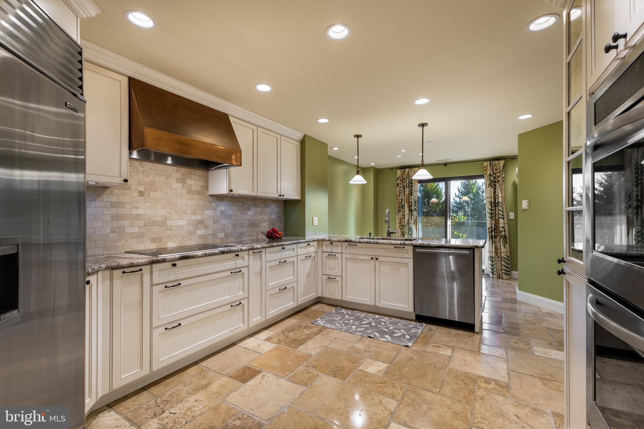 425 Windmere Drive, Unit 3B State College, PA 16801 - Photo 10 of 42 a large kitchen with stainless steel appliances granite countertop a stove and a sink