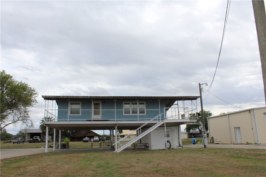 125 Lagarto Ferry Mathis, TX 78368 - Photo 38 of 38 a view of house with roof deck and dining room