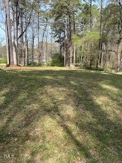 2292 Brad Lane Spring Hope, NC 27882 - Photo 1 of 9 a garden with trees