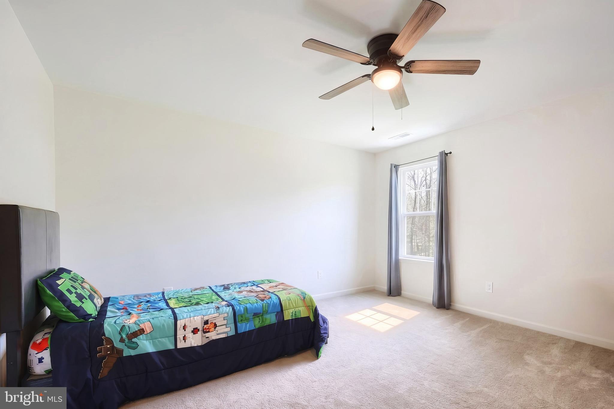 2741 Cold Springs Road Orrtanna, PA 17353 - Photo 30 of 52 a bedroom with a bed and a chandelier fan