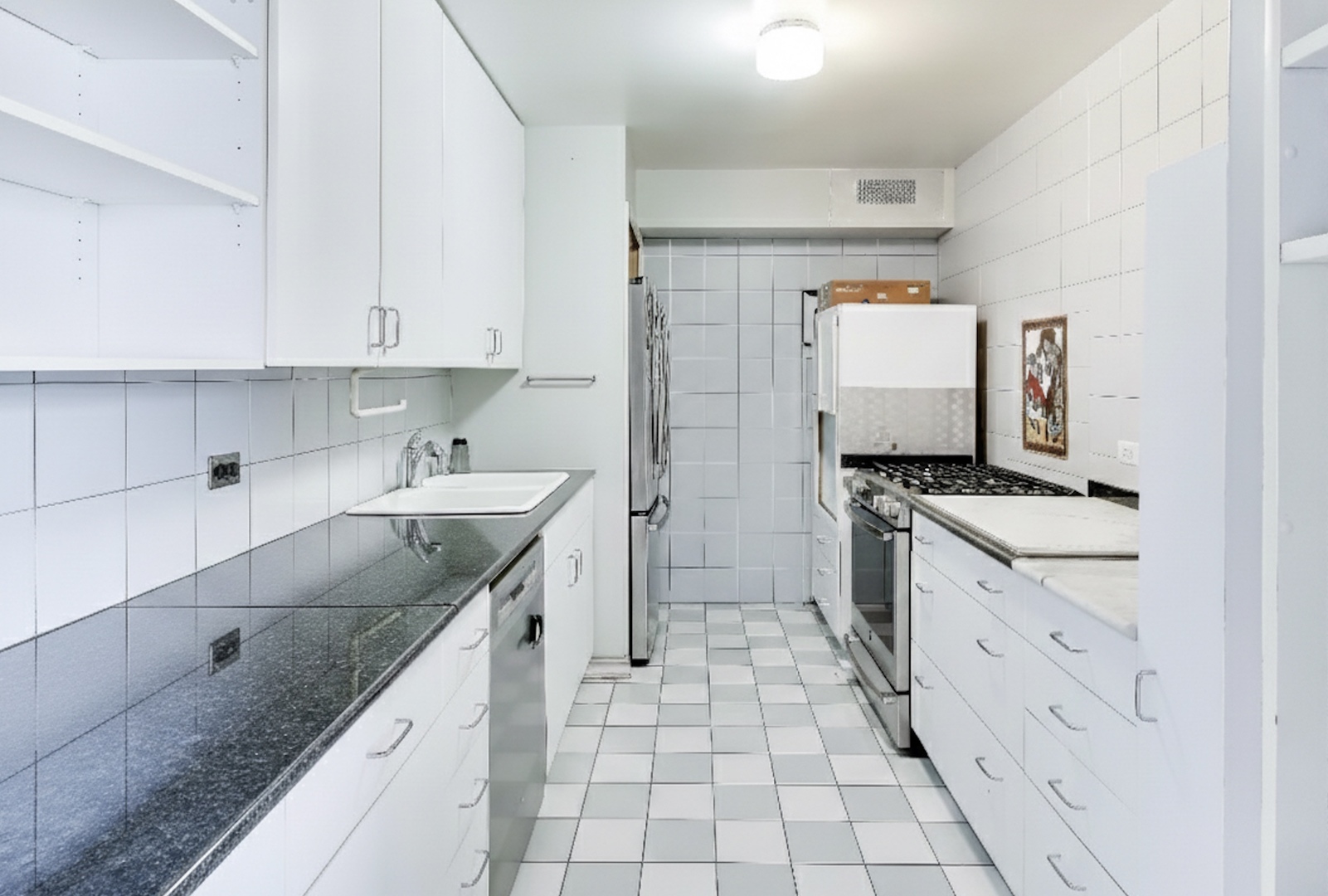 6325 North Sheridan Road, Unit 1602 Chicago, IL 60660 - Photo 9 of 38 a kitchen with granite countertop a sink stove and cabinets