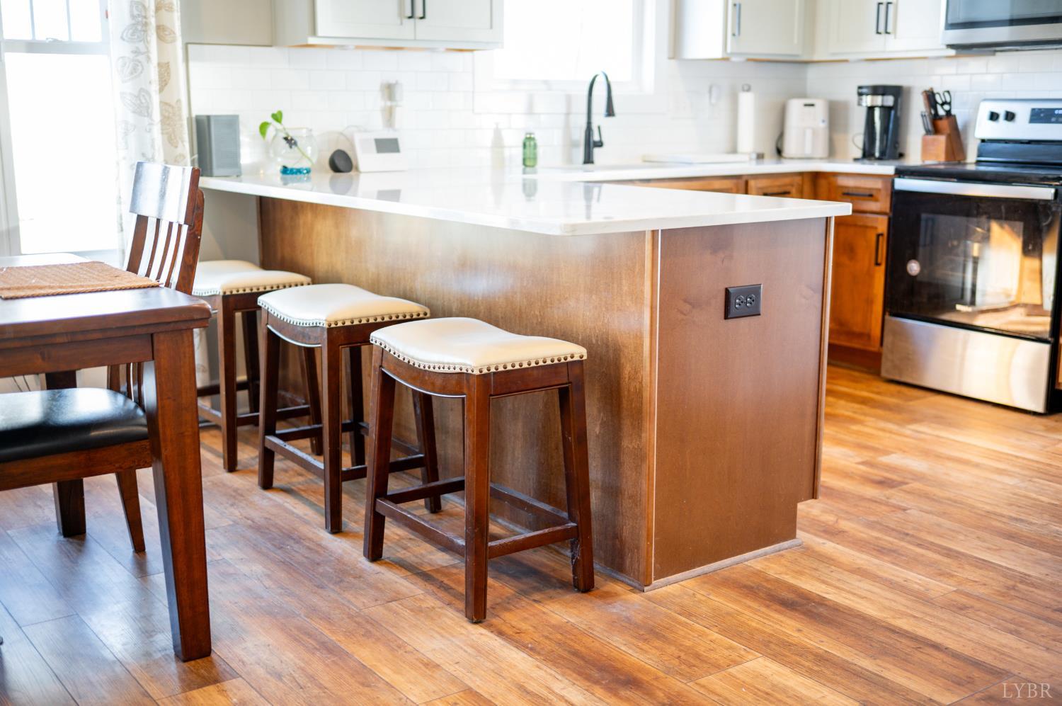 180 Timber Ridge Drive Forest, VA 24551 - Photo 11 of 58 a workspace with furniture and wooden floor