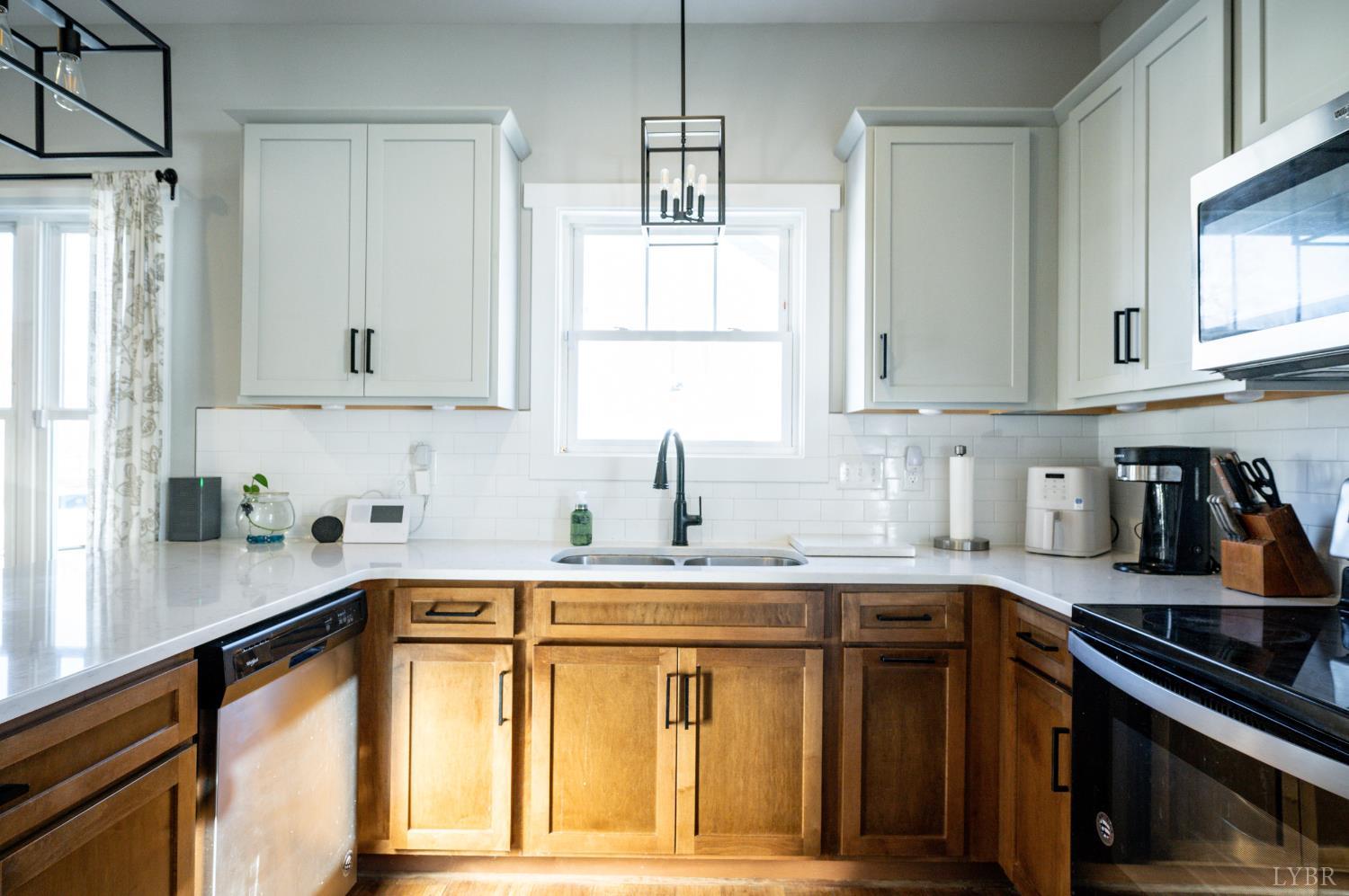 180 Timber Ridge Drive Forest, VA 24551 - Photo 13 of 58 a kitchen with stainless steel appliances granite countertop a sink stove and cabinets