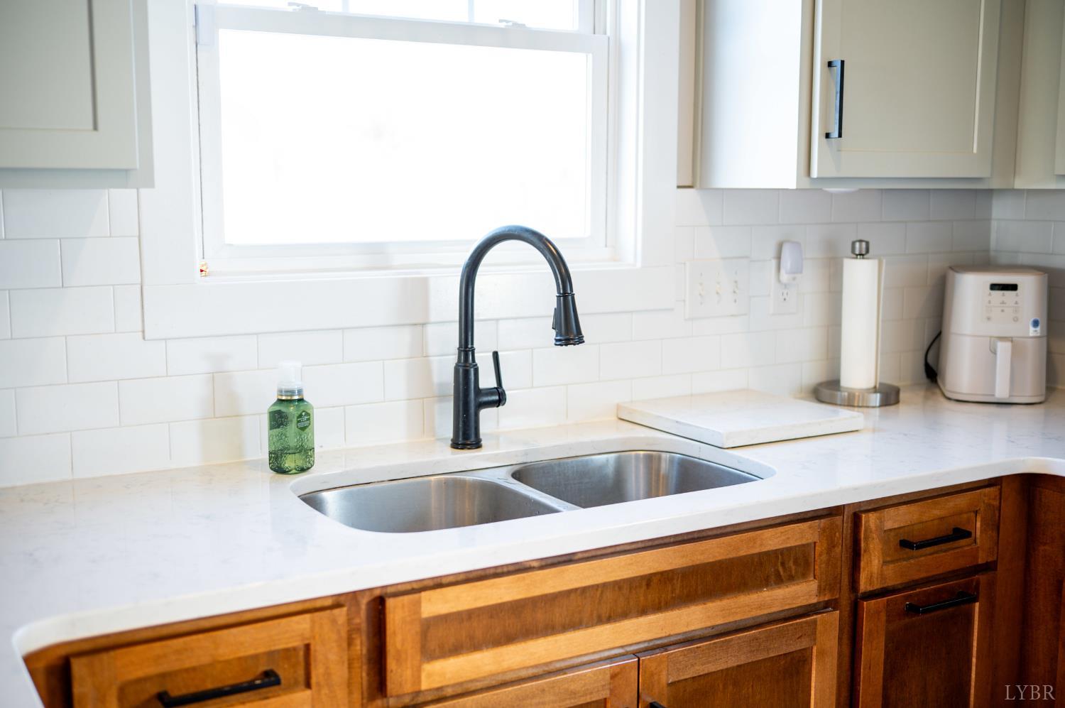 180 Timber Ridge Drive Forest, VA 24551 - Photo 14 of 58 a kitchen with sink and cabinets