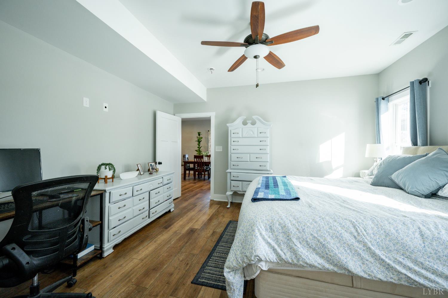 180 Timber Ridge Drive Forest, VA 24551 - Photo 25 of 58 a bedroom with a bed and a chandelier