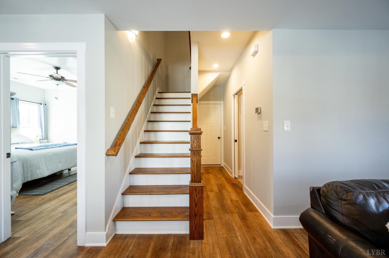 180 Timber Ridge Drive Forest, VA 24551 - Photo 26 of 58 a view of a livingroom with wooden floor and stairs