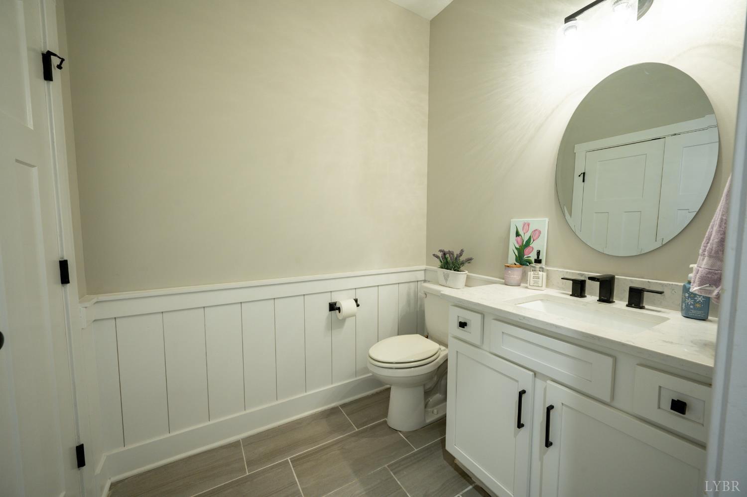 180 Timber Ridge Drive Forest, VA 24551 - Photo 27 of 58 a bathroom with a sink and a mirror