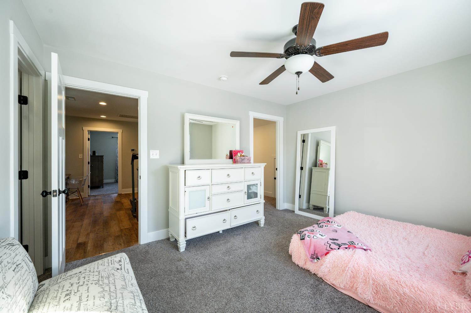 180 Timber Ridge Drive Forest, VA 24551 - Photo 33 of 58 a bedroom with a bed and a chandelier