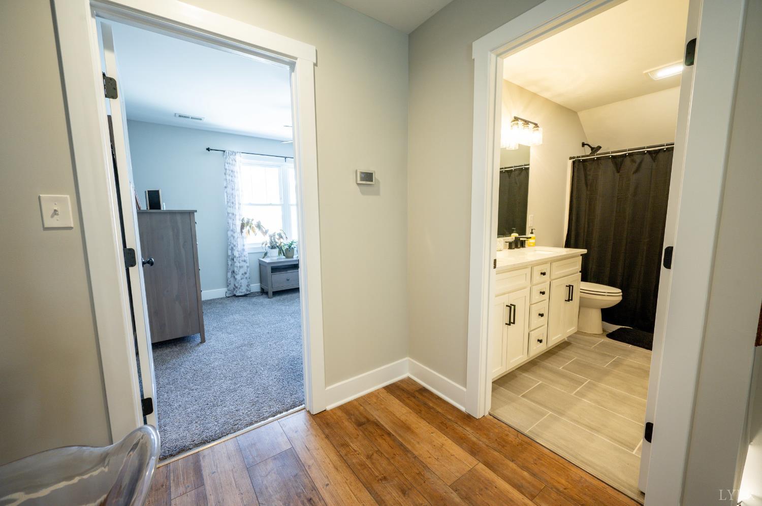 180 Timber Ridge Drive Forest, VA 24551 - Photo 34 of 58 a view of a hallway with bathroom and wooden floor