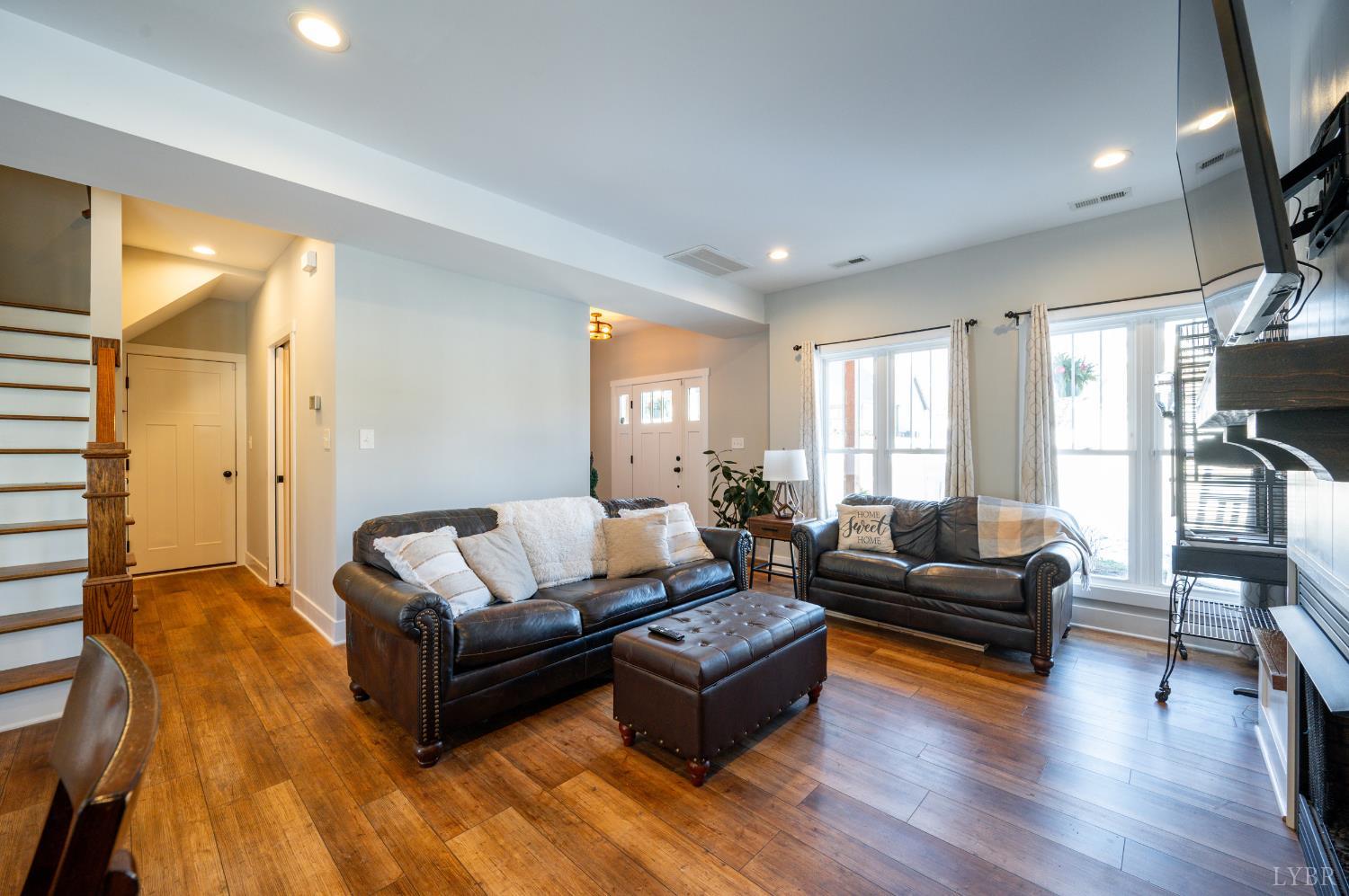 180 Timber Ridge Drive Forest, VA 24551 - Photo 7 of 58 a living room with furniture and a wooden floor