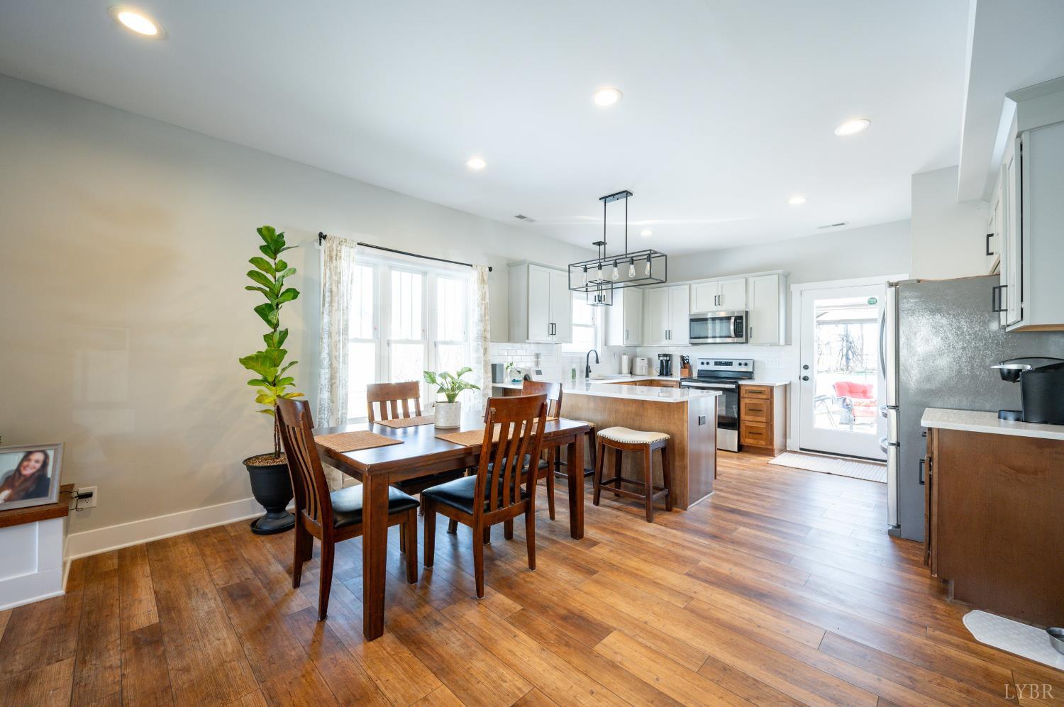 180 Timber Ridge Drive Forest, VA 24551 - Photo 8 of 58 a view of kitchen with dining table chairs chandelier and stainless steel appliances