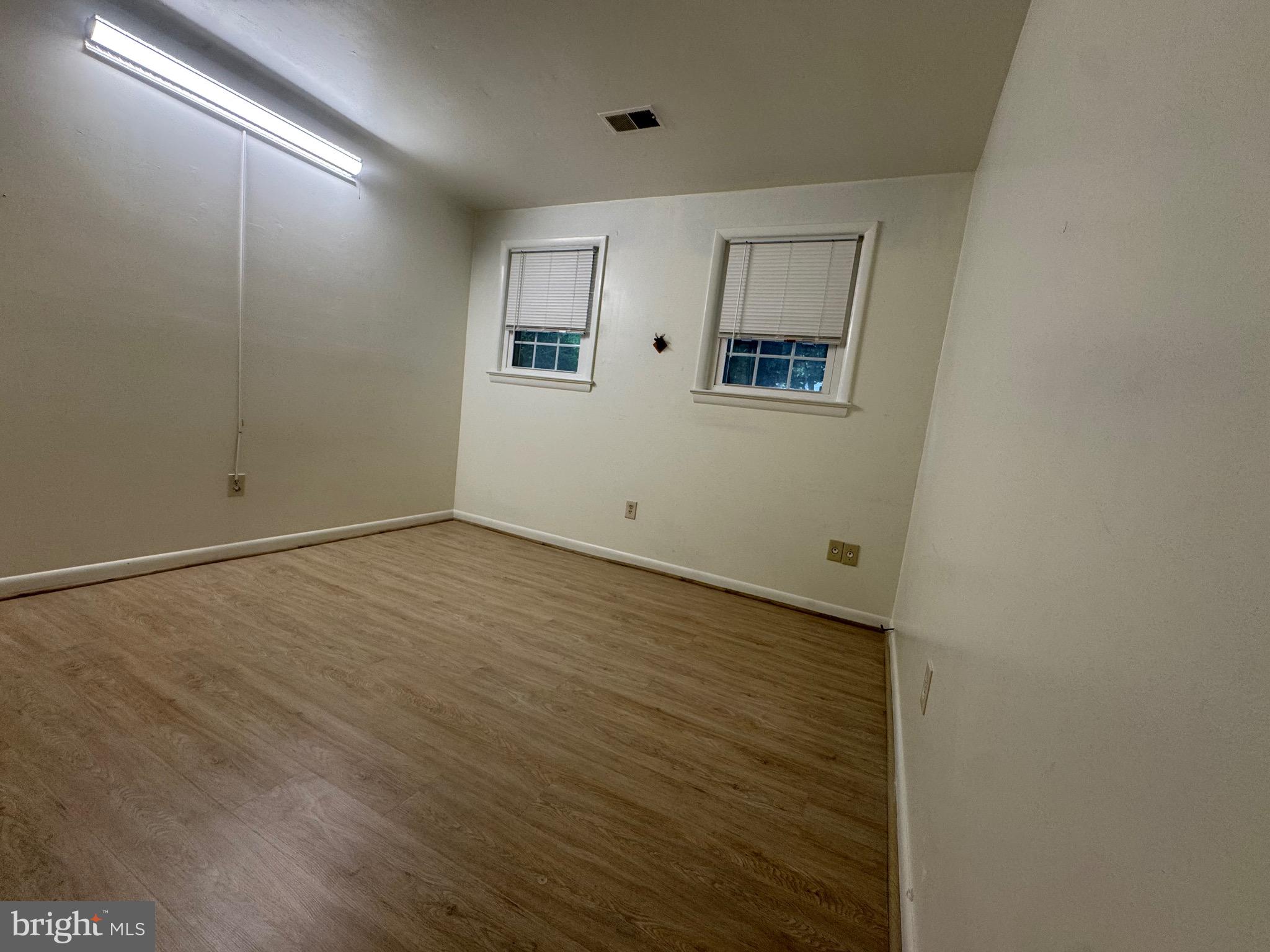 212 11th Street Laurel, MD 20707 - Photo 19 of 39 a view of a room with wooden floor