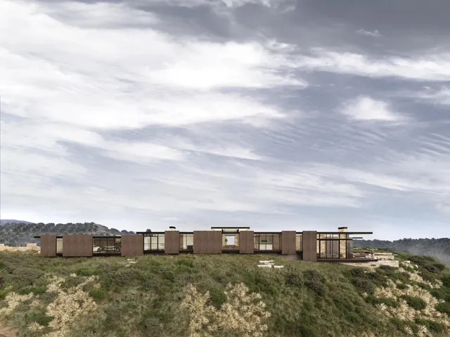 a view of a big house with a mountain in the background