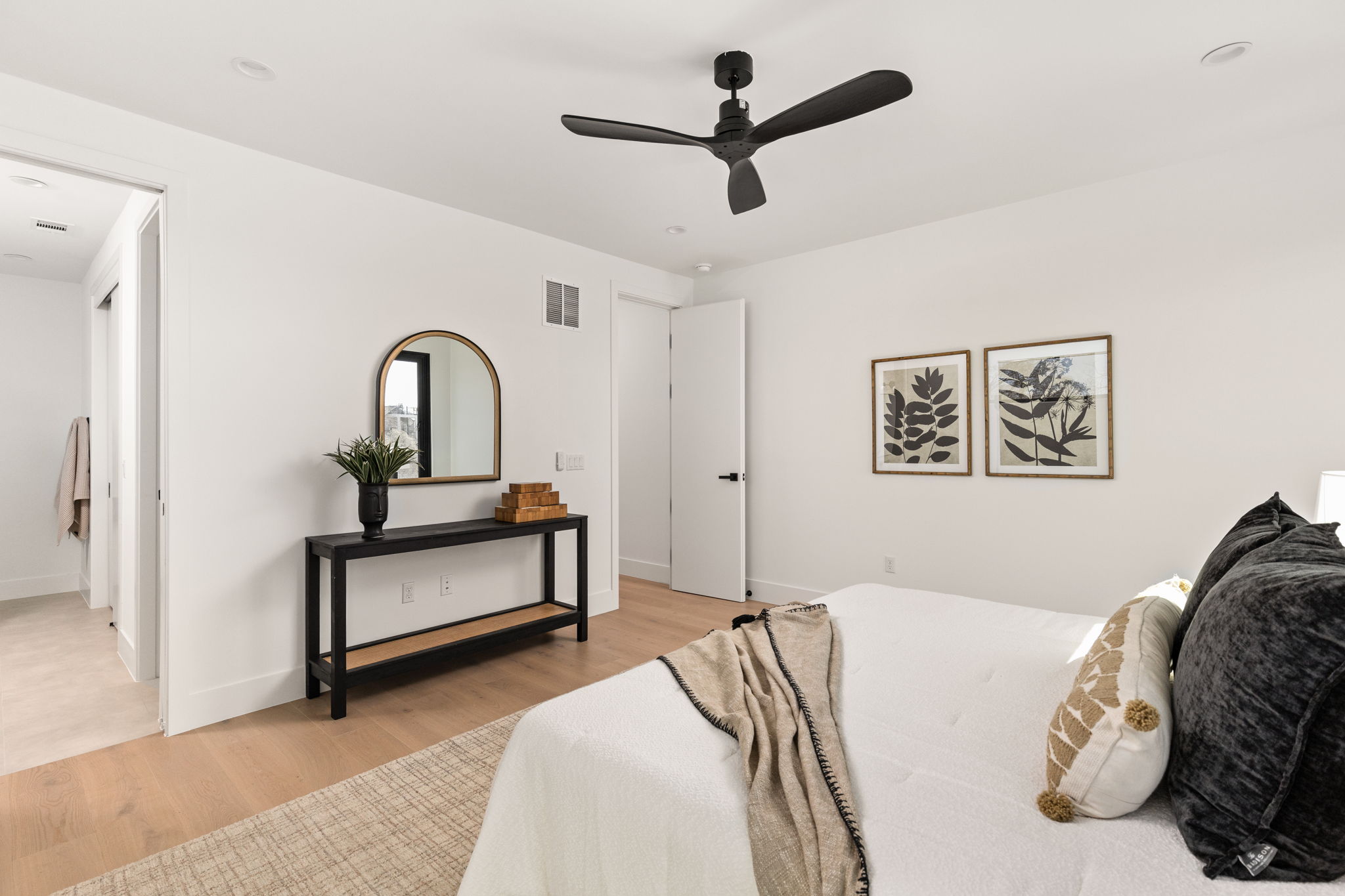 1610 Harvey Street, Unit 2 Austin, TX 78702 - Photo 16 of 38 Bedroom with light wood finished floors and ceiling fan