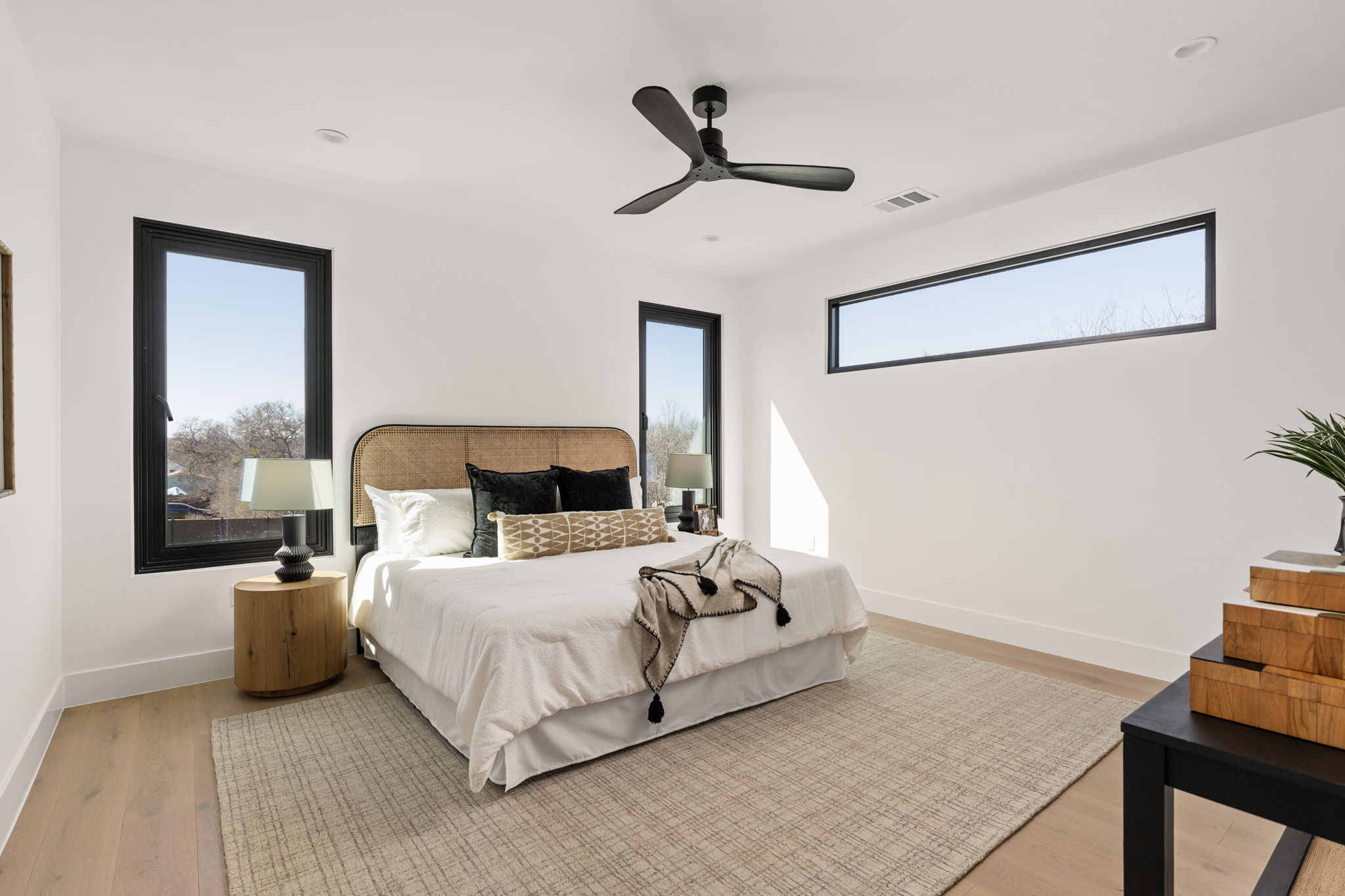 1610 Harvey Street, Unit 2 Austin, TX 78702 - Photo 17 of 38 Bedroom with light wood finished floors and ceiling fan