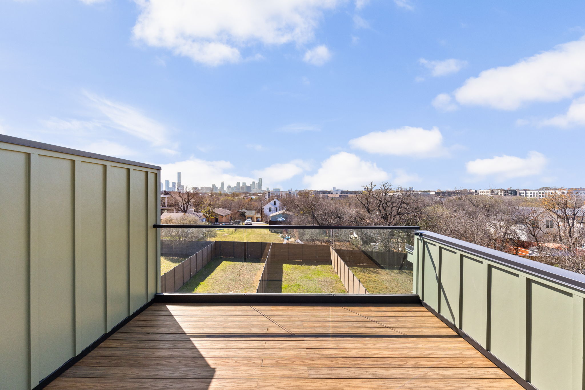 1610 Harvey Street, Unit 2 Austin, TX 78702 - Photo 25 of 38 Wooden terrace featuring a view of skyline