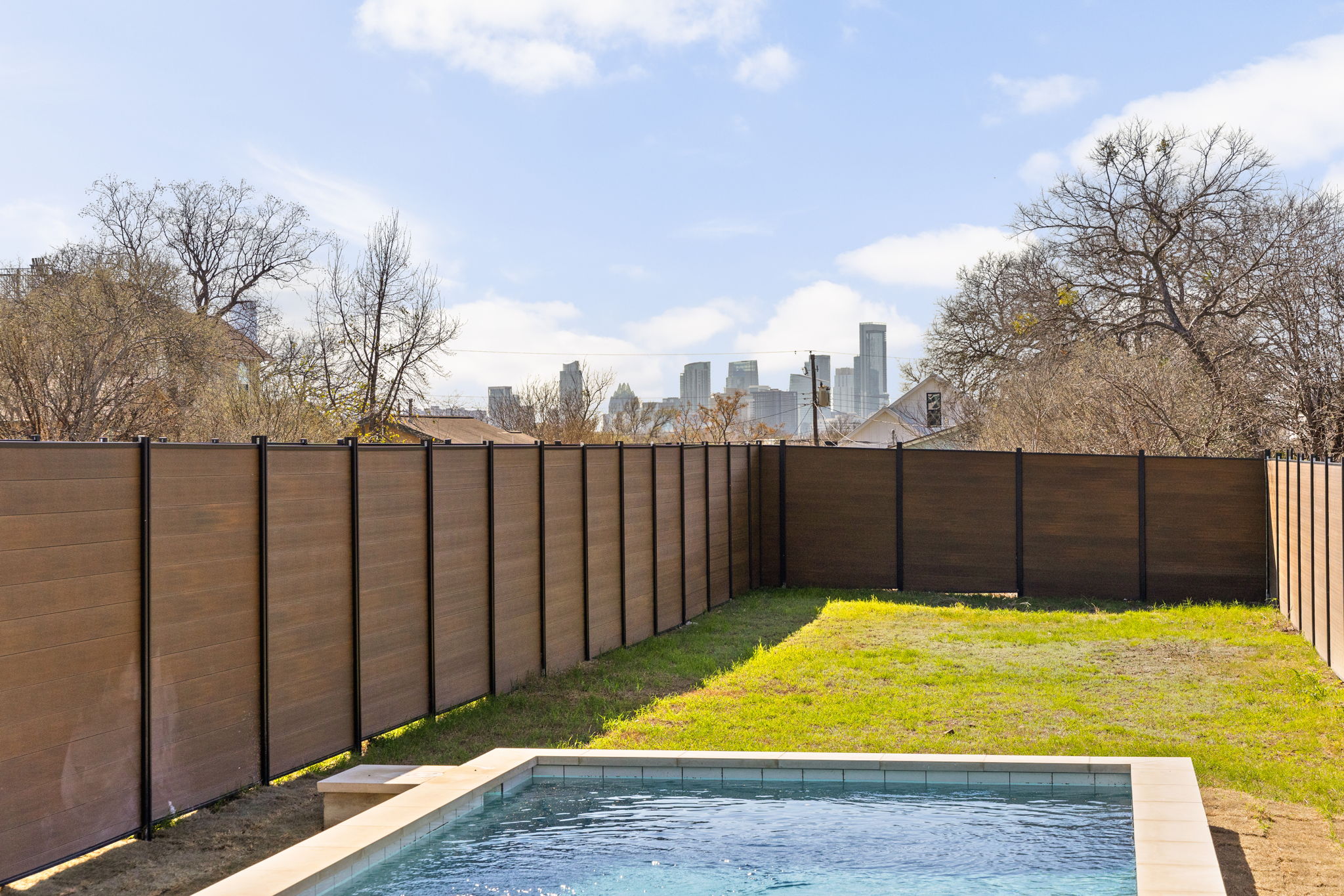 1610 Harvey Street, Unit 2 Austin, TX 78702 - Photo 28 of 38 View of pool with a fenced backyard and a view of skyline