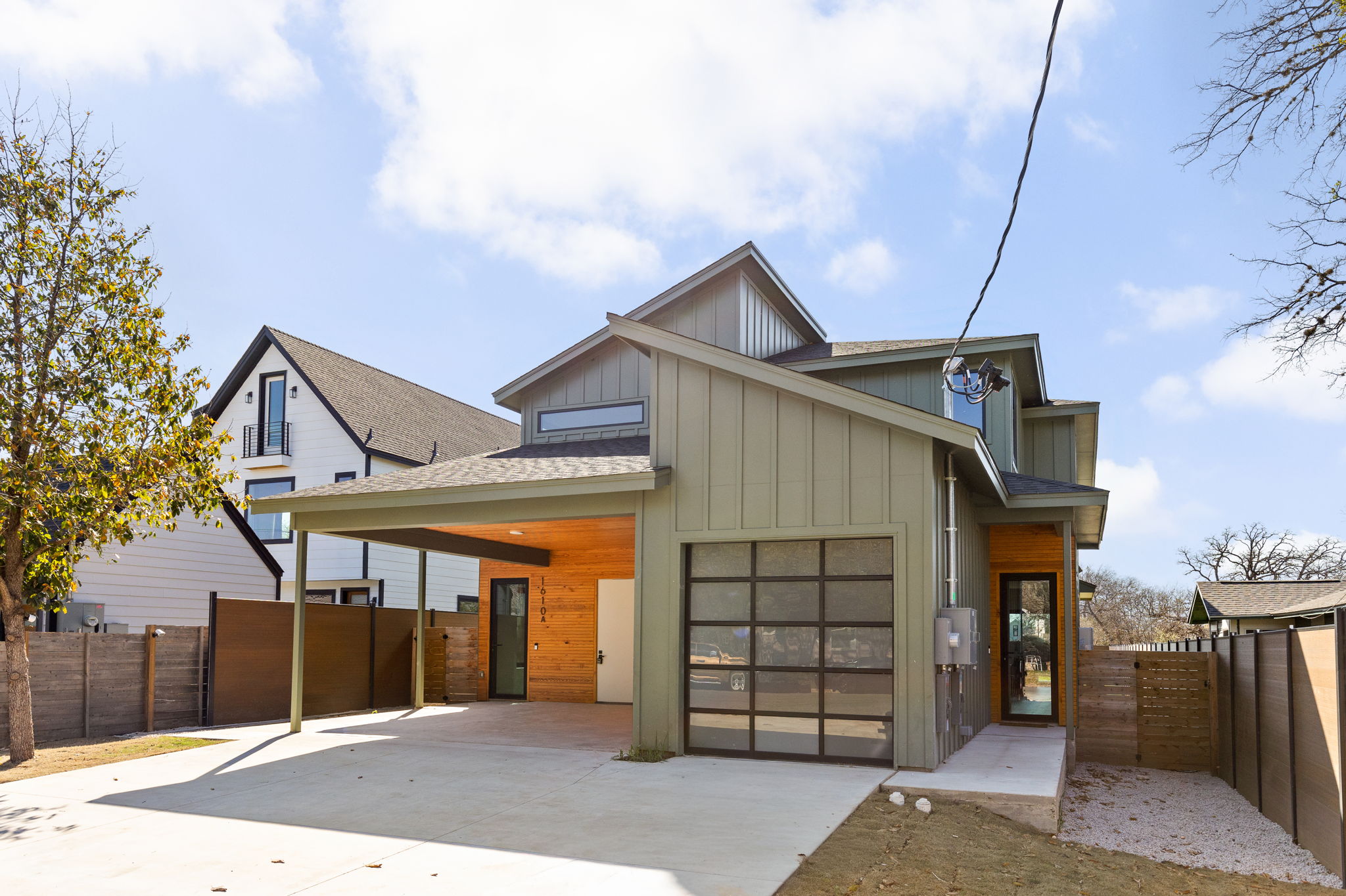 1610 Harvey Street, Unit 2 Austin, TX 78702 - Photo 3 of 39 a front view of a house with a garage