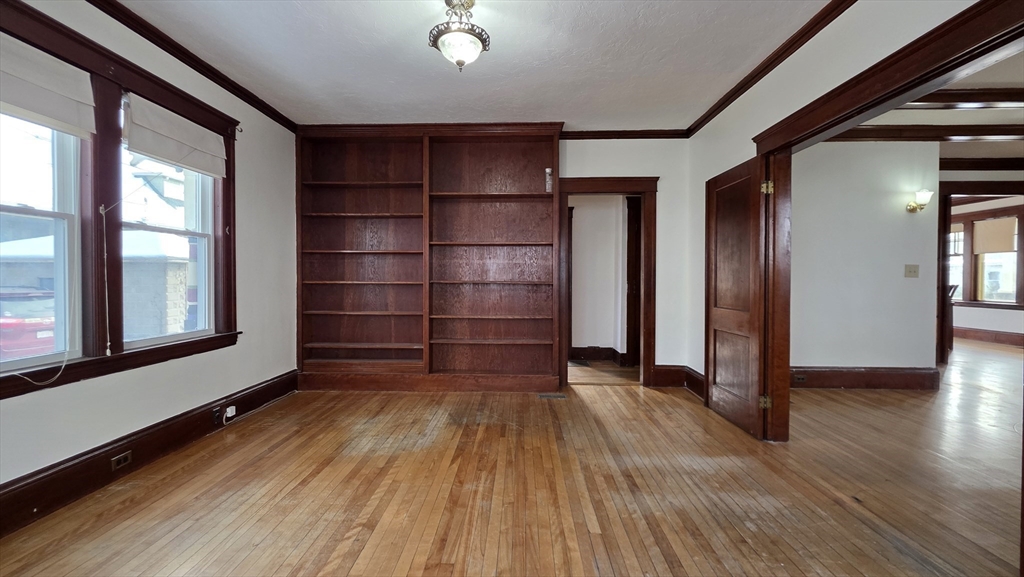 46 Wachusett Street Worcester, MA 01609 - Photo 16 of 42 wooden floor in an empty room with a window