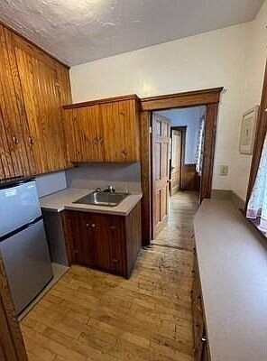 46 Wachusett Street Worcester, MA 01609 - Photo 20 of 42 a kitchen with stainless steel appliances granite countertop a sink a stove and a refrigerator