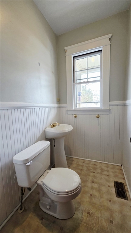46 Wachusett Street Worcester, MA 01609 - Photo 21 of 42 a bathroom with a toilet a sink and a window