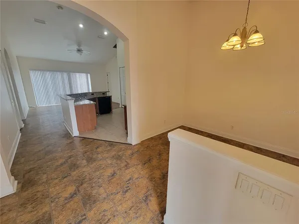 a view of a livingroom with a kitchen