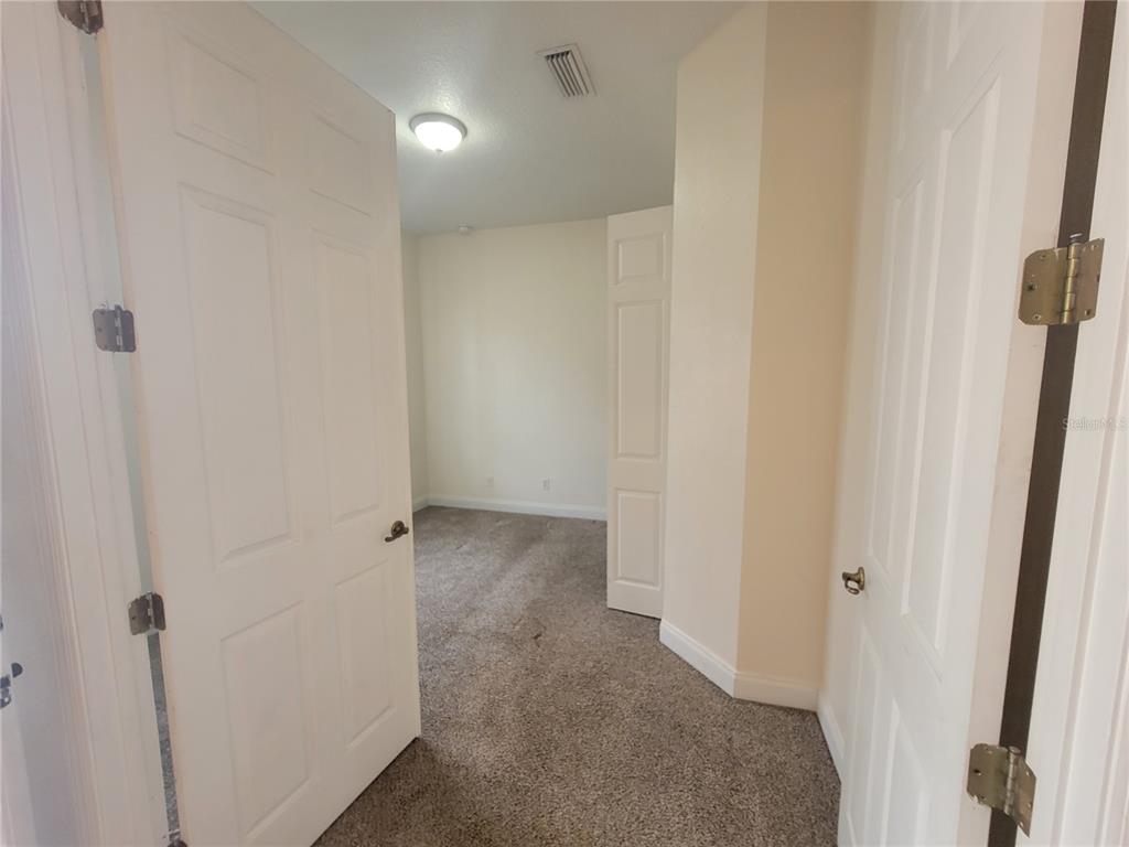 13092 Southwest 84th Terrace Road Ocala, FL 34473 - Photo 5 of 12 a view of a hallway