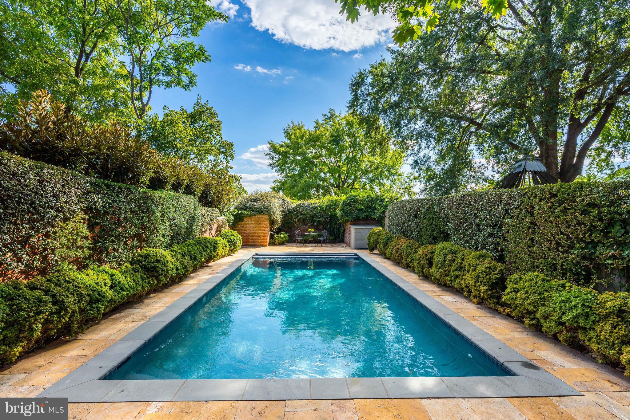 a view of swimming pool from a balcony