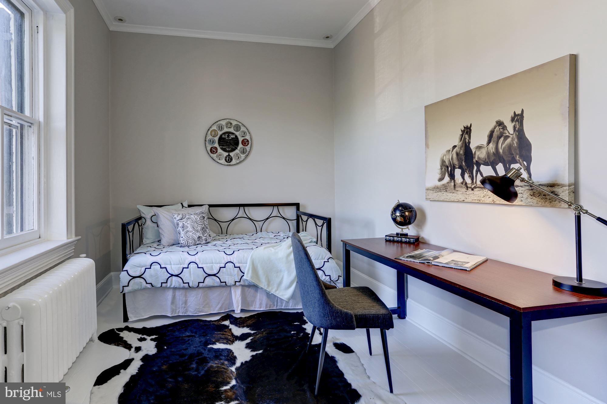 3306 R Street Northwest Washington, DC 20007 - Photo 14 of 24 a bedroom with a bed and a window