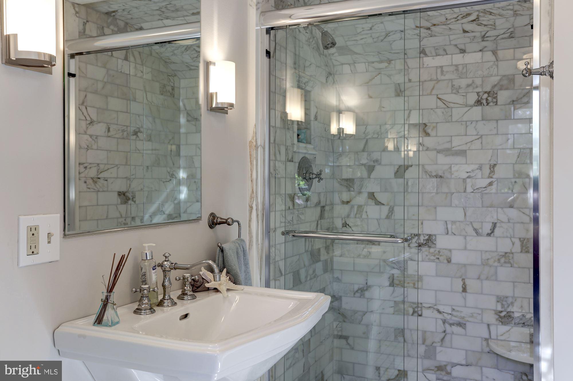 3306 R Street Northwest Washington, DC 20007 - Photo 16 of 24 a bathroom with a sink shower and a mirror