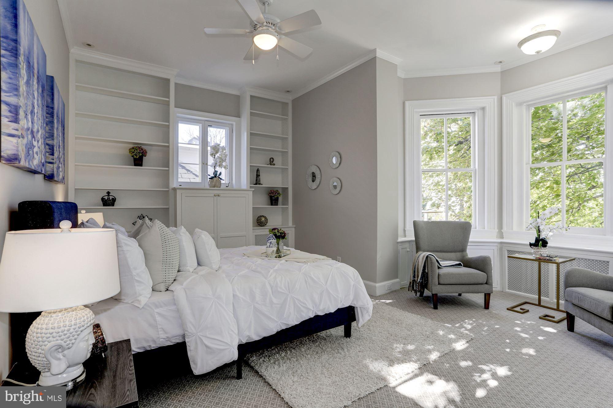 3306 R Street Northwest Washington, DC 20007 - Photo 9 of 24 a spacious bedroom with a bed and large windows