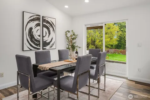 a view of a dining room with furniture window and outside view