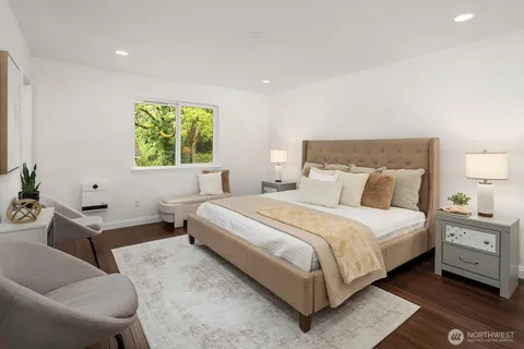 a bedroom with a bed and a couch