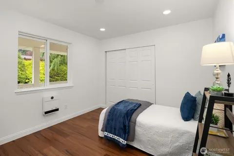a bedroom with a bed and a table in it