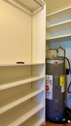 a view of a patio with a table and chairs under an umbrella with a patio
