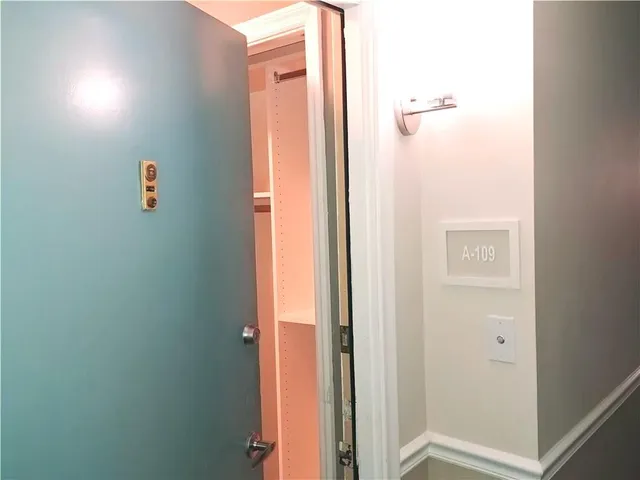 a living room with furniture a table and a large window