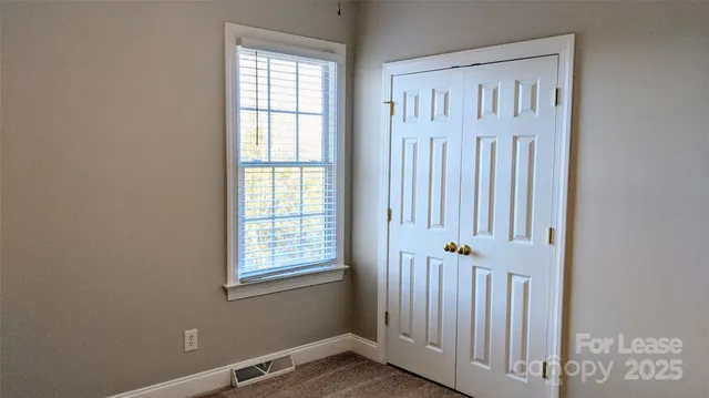 an entrance view of a livingroom with a window