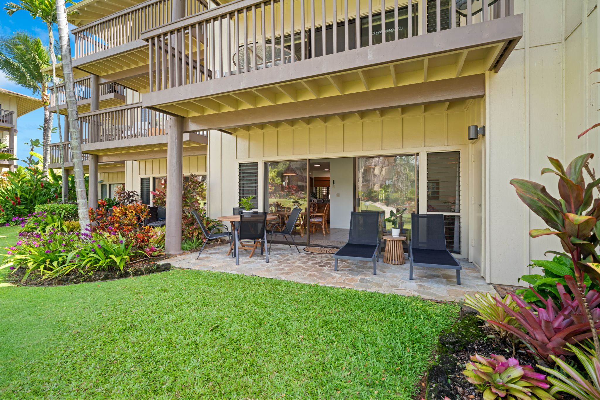 410 Papaloa Road, Unit 316 Kapaa, HI 96746 - Photo 15 of 30 a view of a chair and table in front of a house