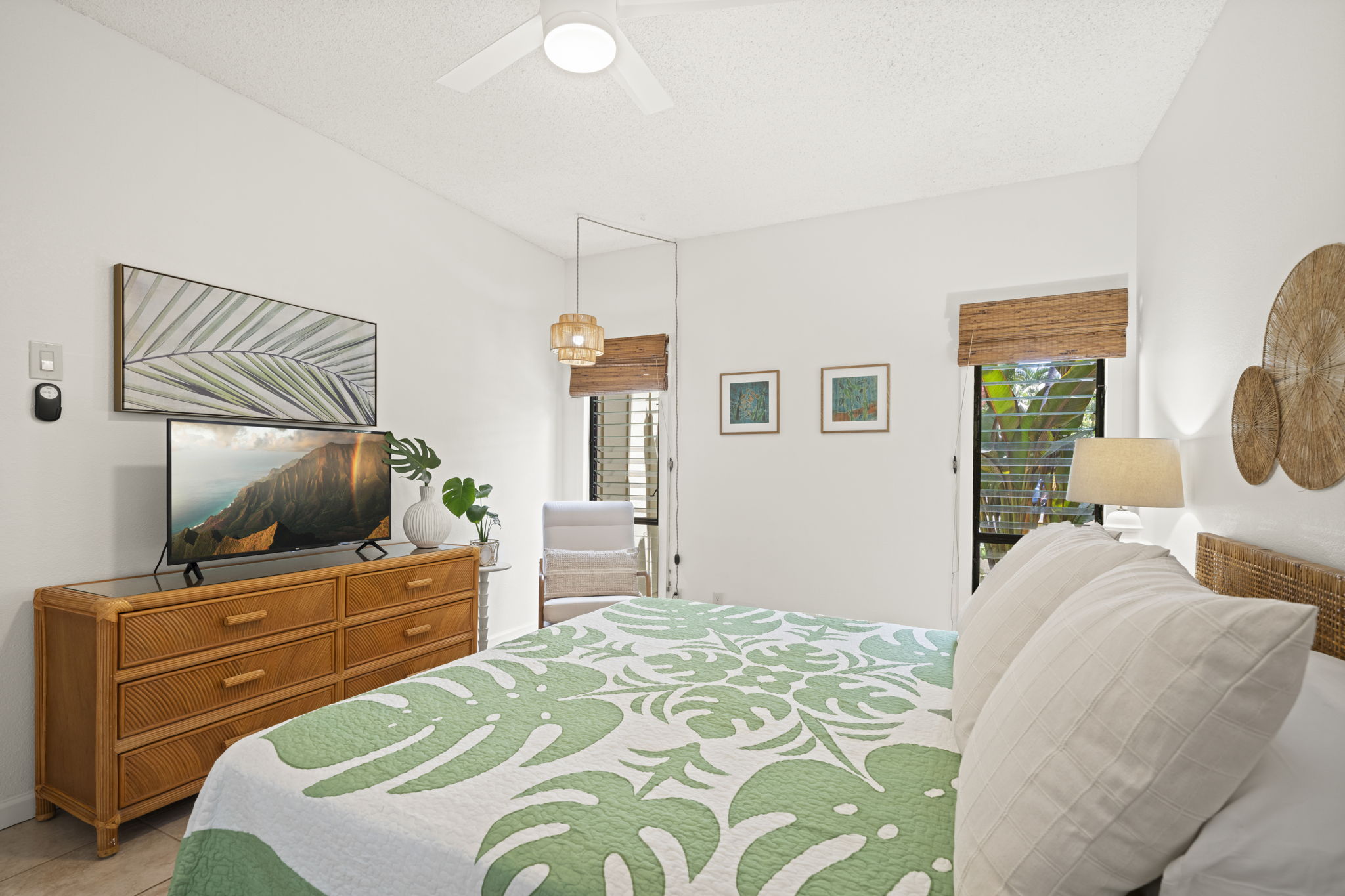 410 Papaloa Road, Unit 316 Kapaa, HI 96746 - Photo 19 of 30 a bedroom with a bed and a flat screen tv