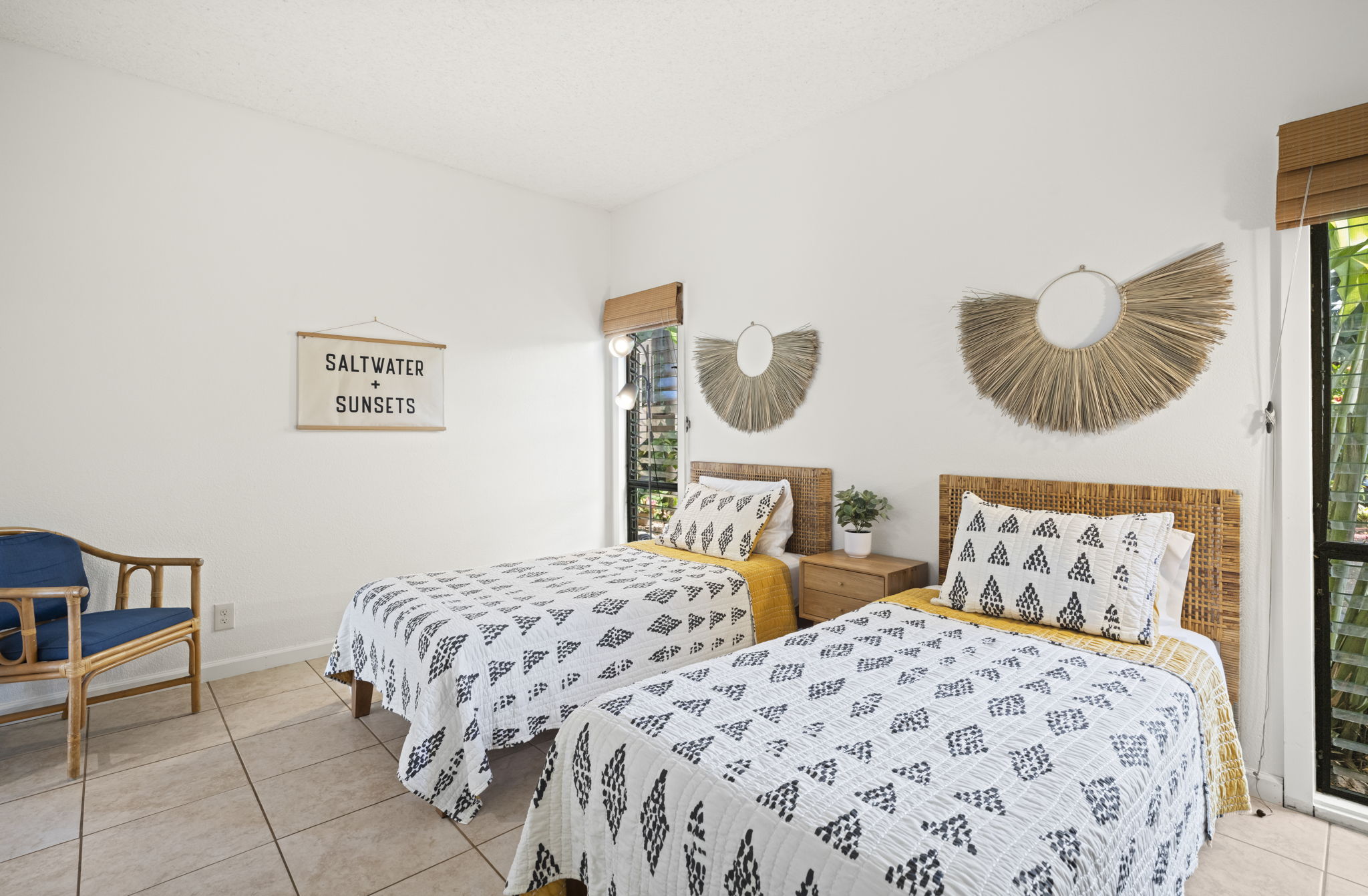 410 Papaloa Road, Unit 316 Kapaa, HI 96746 - Photo 23 of 30 a bedroom with two beds and painting on the wall