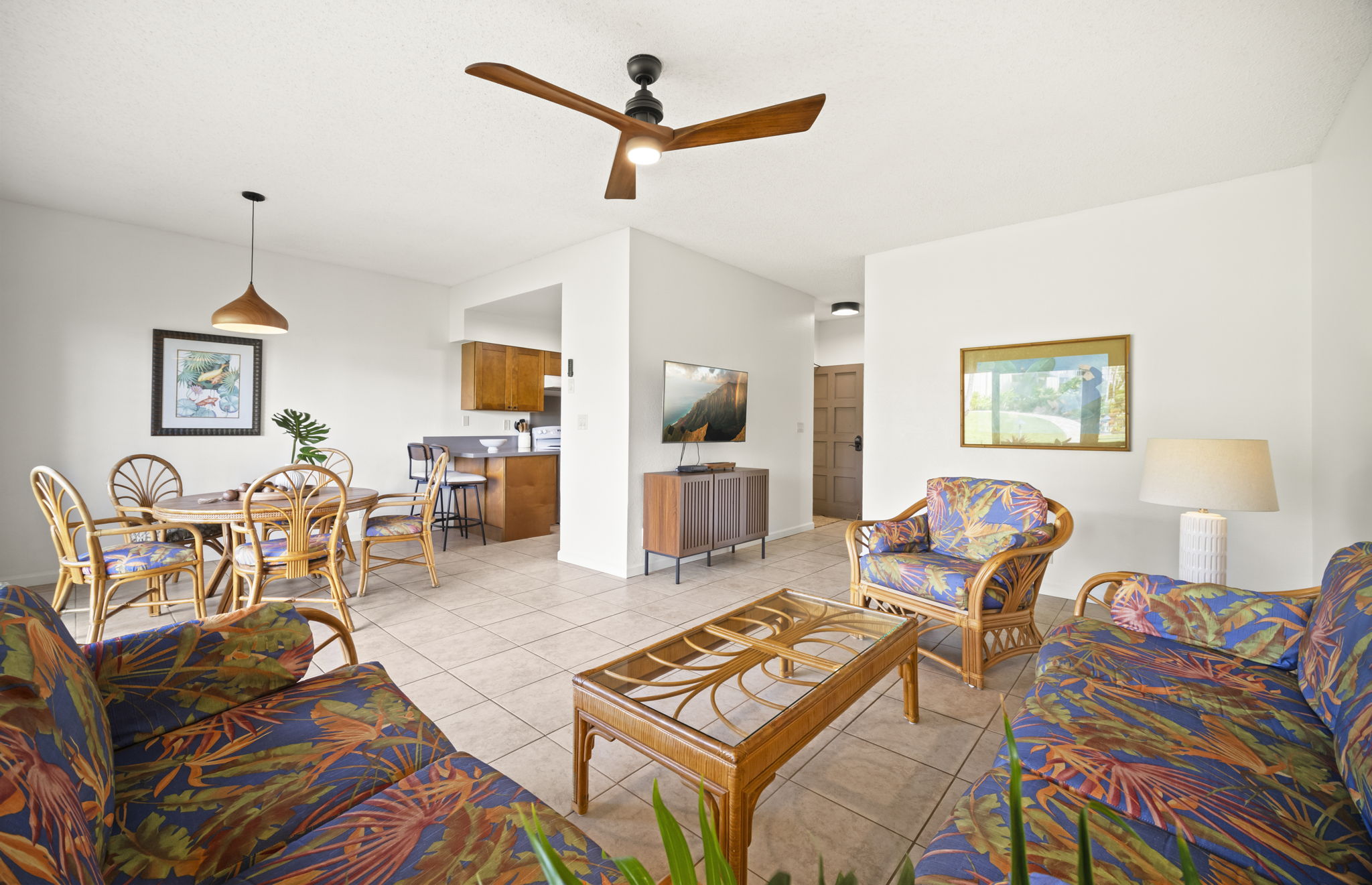 410 Papaloa Road, Unit 316 Kapaa, HI 96746 - Photo 4 of 30 a living room with furniture a flat screen tv and a table