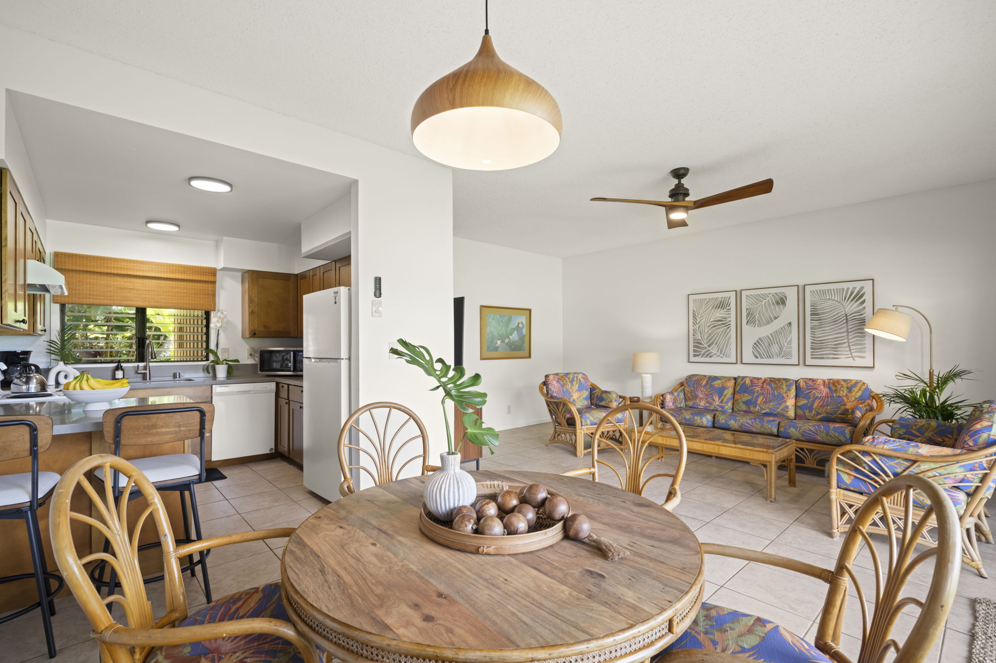 410 Papaloa Road, Unit 316 Kapaa, HI 96746 - Photo 6 of 30 a living room with furniture and a dining table with wooden floor